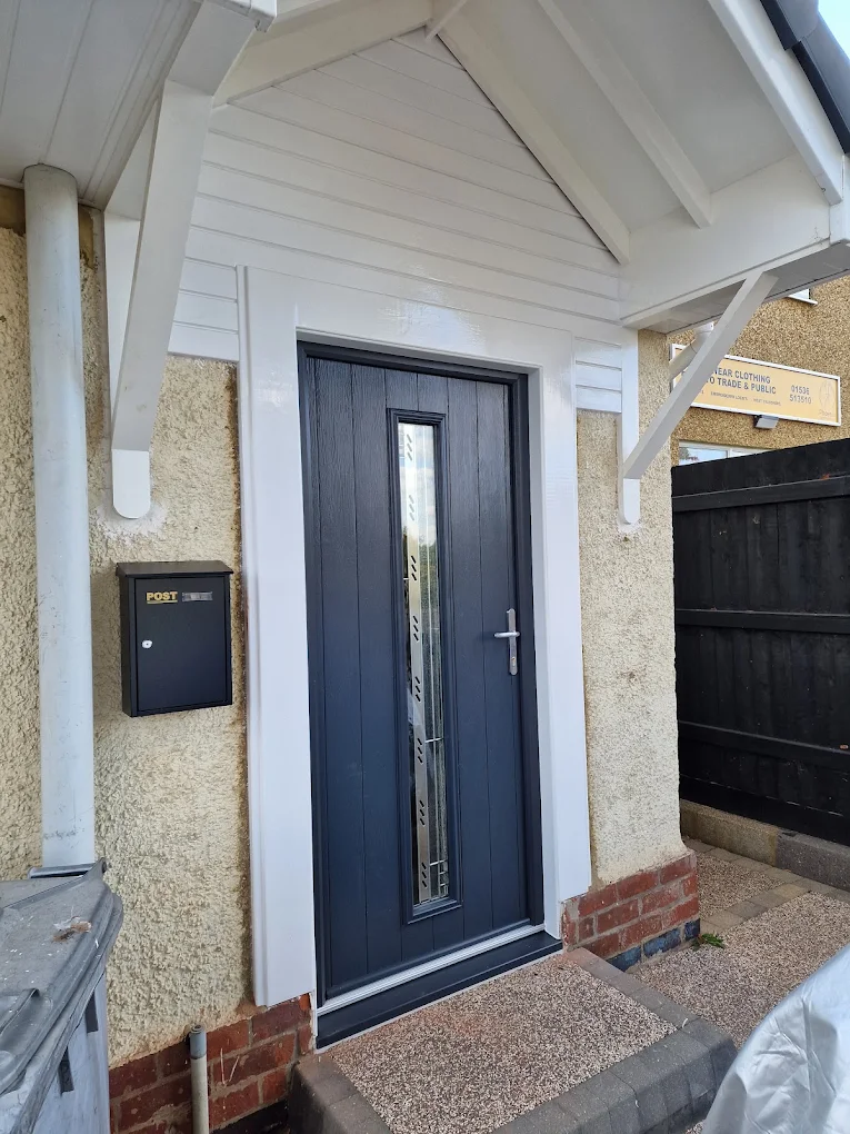 Anthracite grey composite front door with frosted side light, fitted by Glazing Trade Supplies